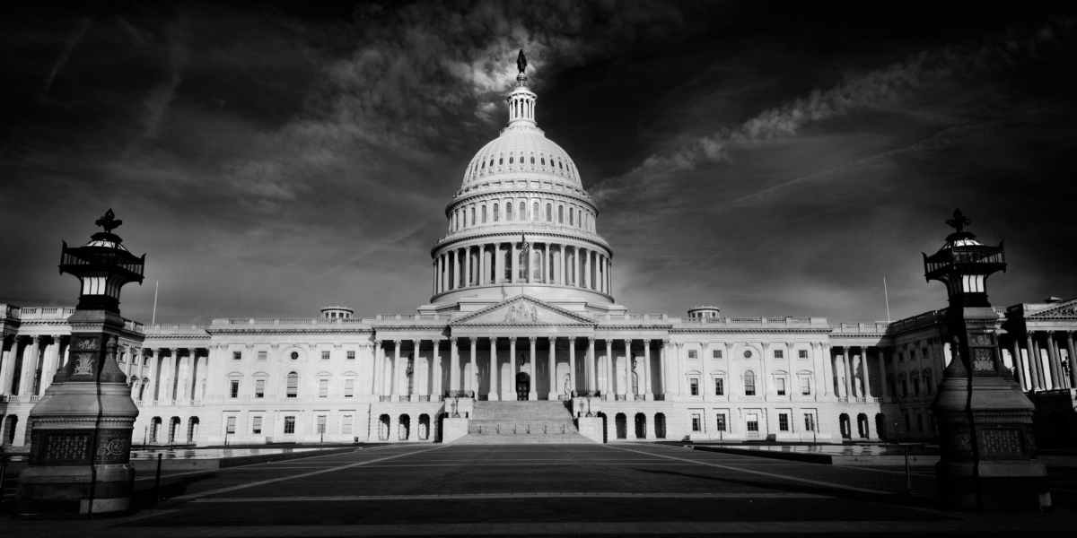 A black-and-white photo of the U.S. Capitol Building.